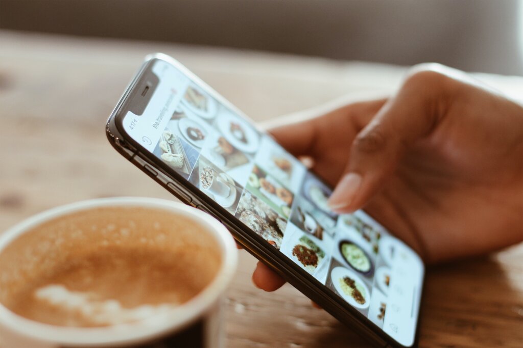 woman using cellphone in a coffee shop