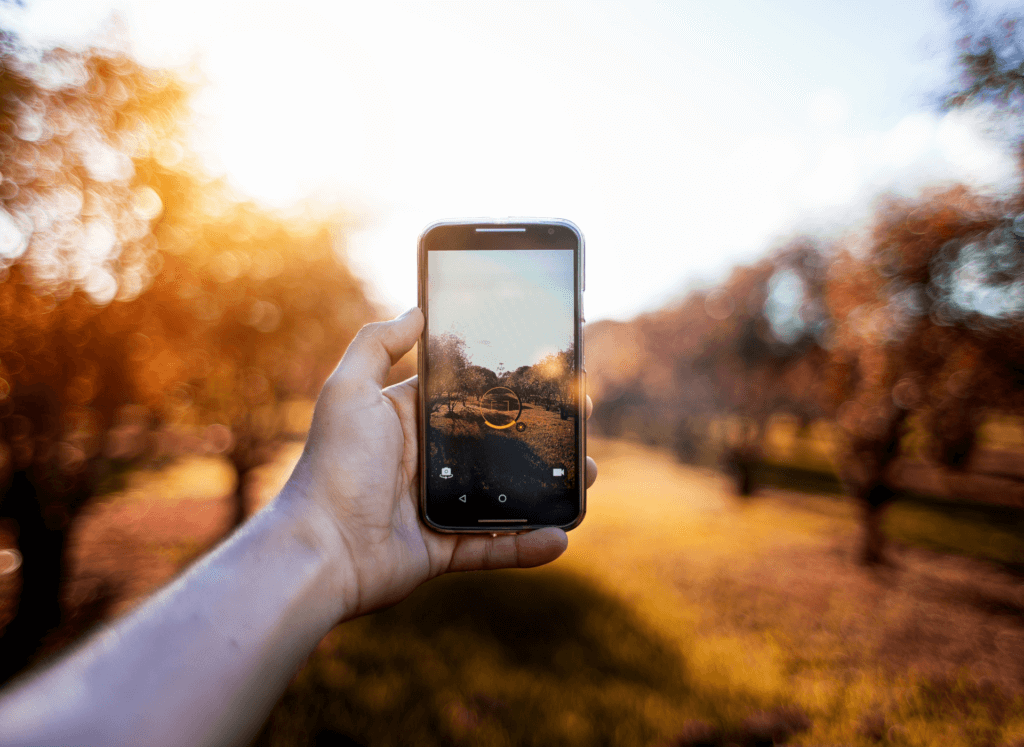 person taking photo os landscape